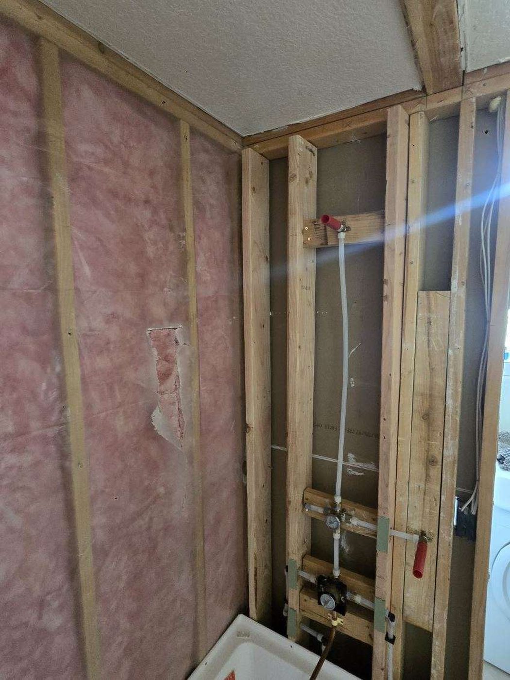 Plumbing repair: shower valve rough-in during a bathroom remodel in Colorado